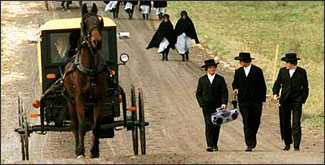 Amish teens walking with a boombox while VanHouten was in business